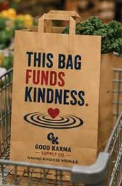 A Good Karma Bag full of groceries in a shopping cart